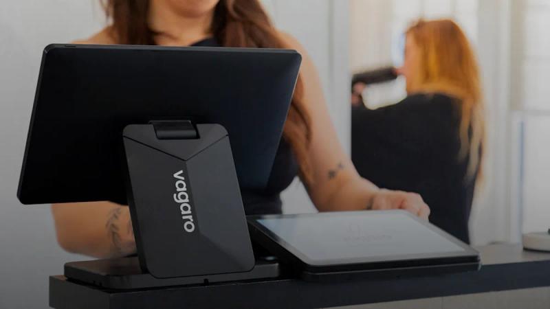 Woman using a tablet at a checkout counter