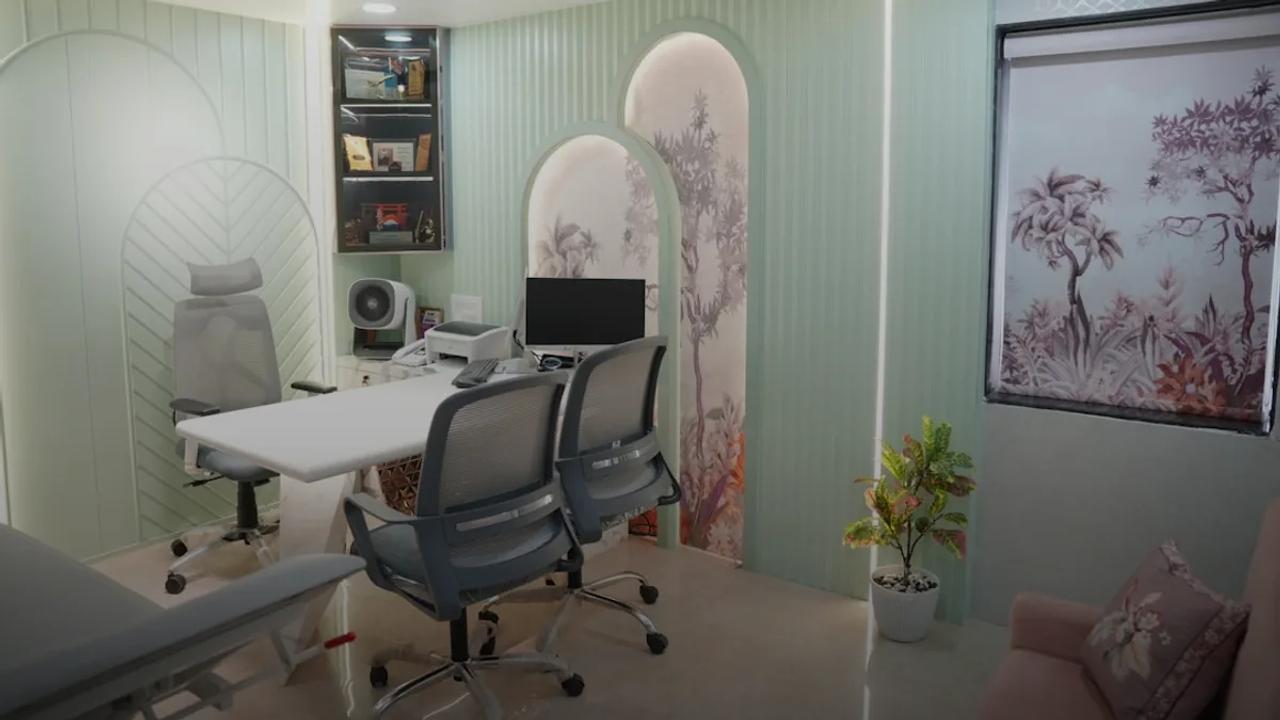 Modern office with desk, chairs, and computer.