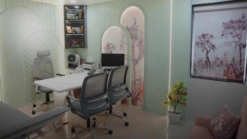Modern office with desk, chairs, and computer.