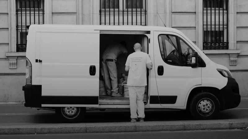 a man standing next to a van