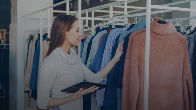 Woman shopping for clothes in a boutique.