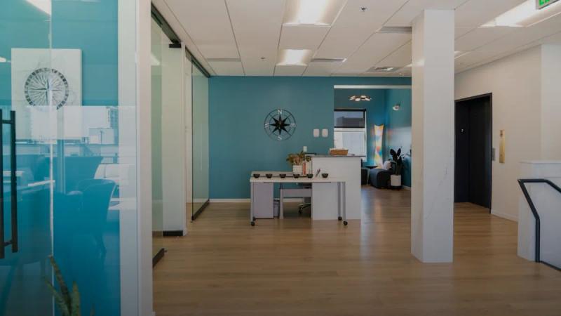 A bright and modern office interior is shown.