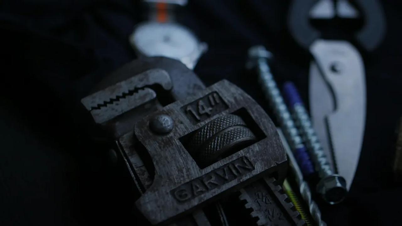selective focus photography of 14' grey Garvin metal pipe wrench