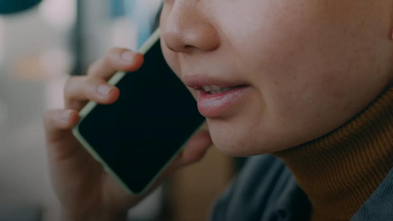 A woman is talking on a cell phone