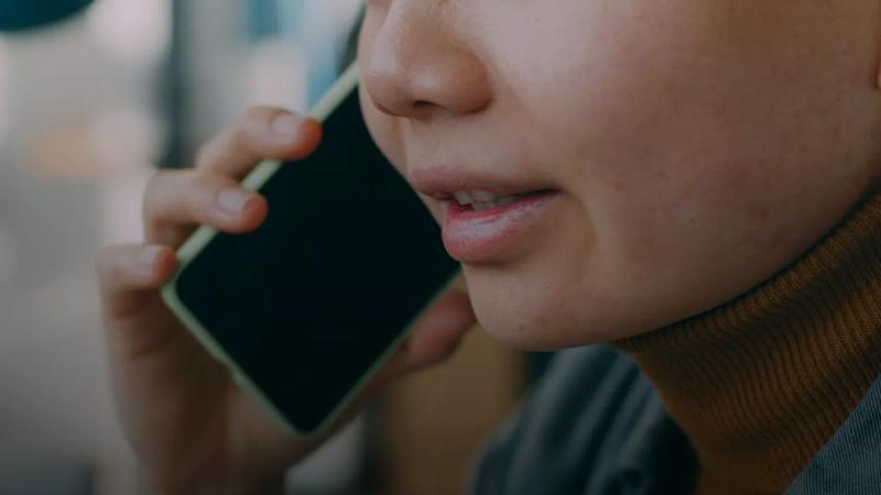 A woman is talking on a cell phone