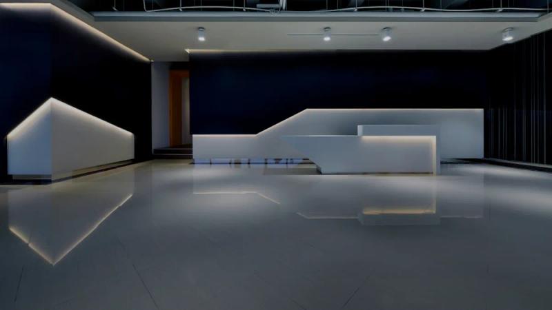 a large room with a white counter and black walls