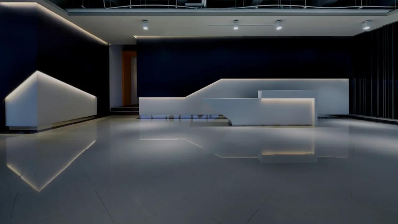 a large room with a white counter and black walls